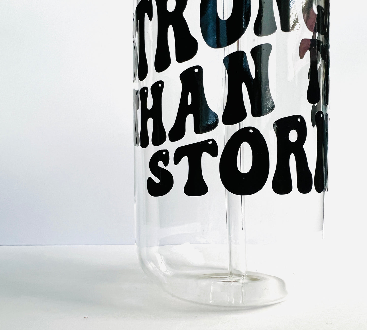 STRONGER THAN THE STORM drinking glass